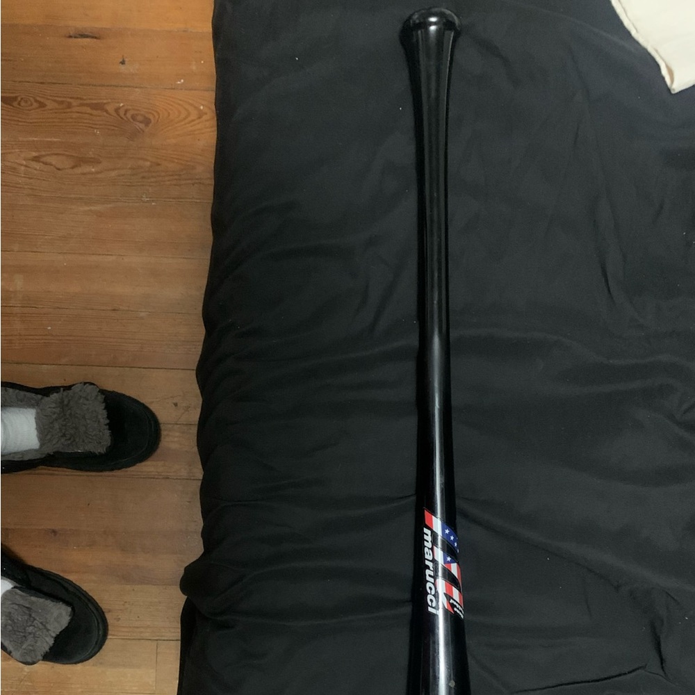 Black marucci Baseball Bat with American Flag Design in middle